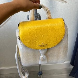 Kate Spade backpack, yellow. Brand new with tag.